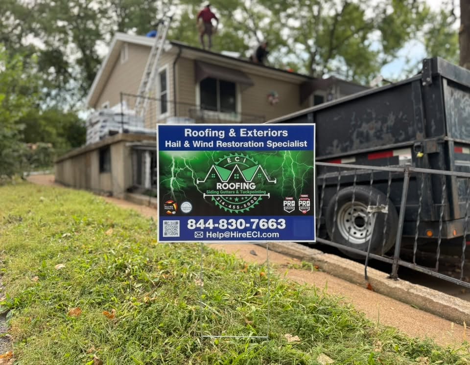 ECI yard sign beside the dump trailer at a tear-off job
