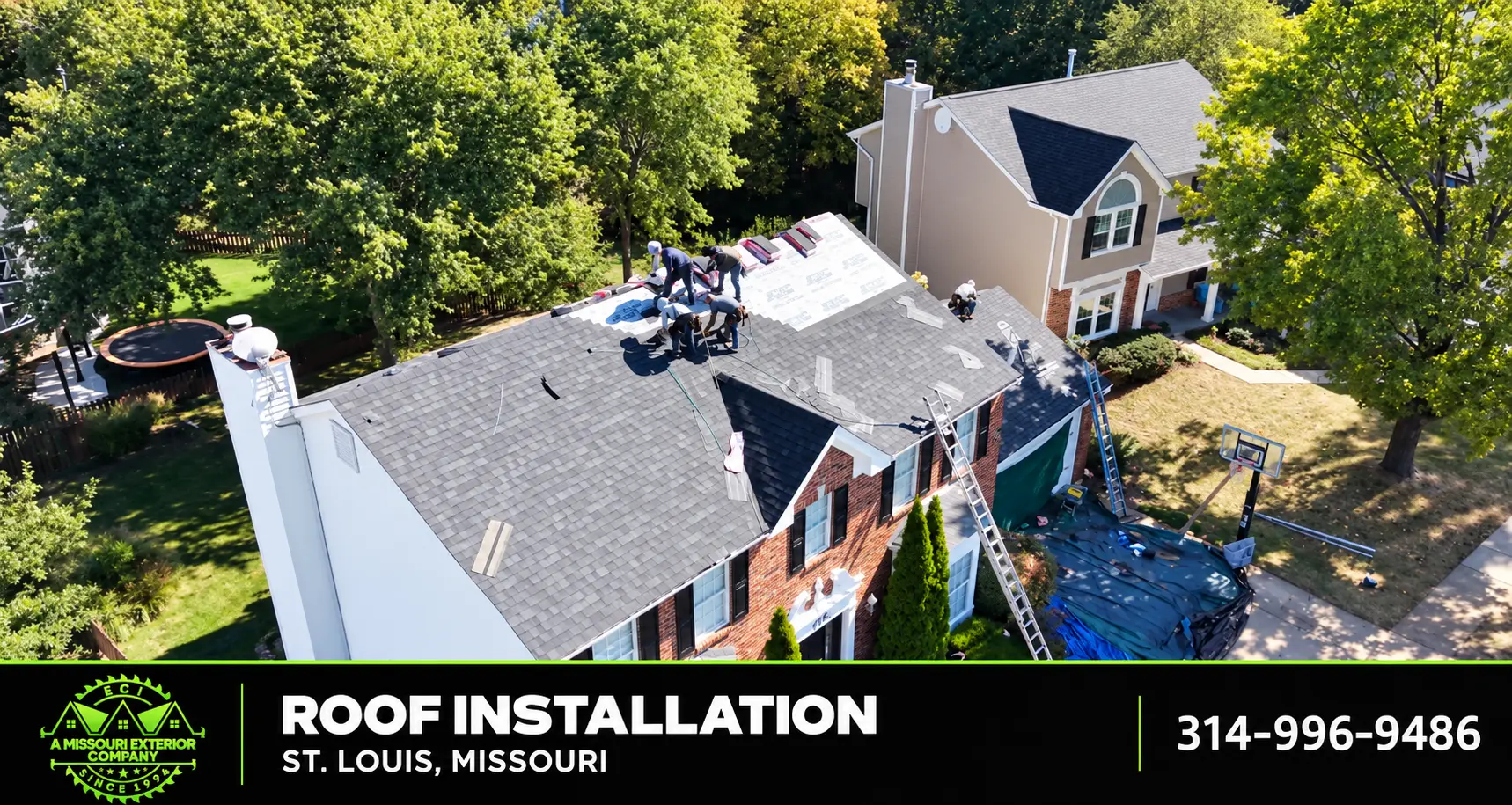 Aerial of ECI crew replacing the roof on a two-story home in St. Louis