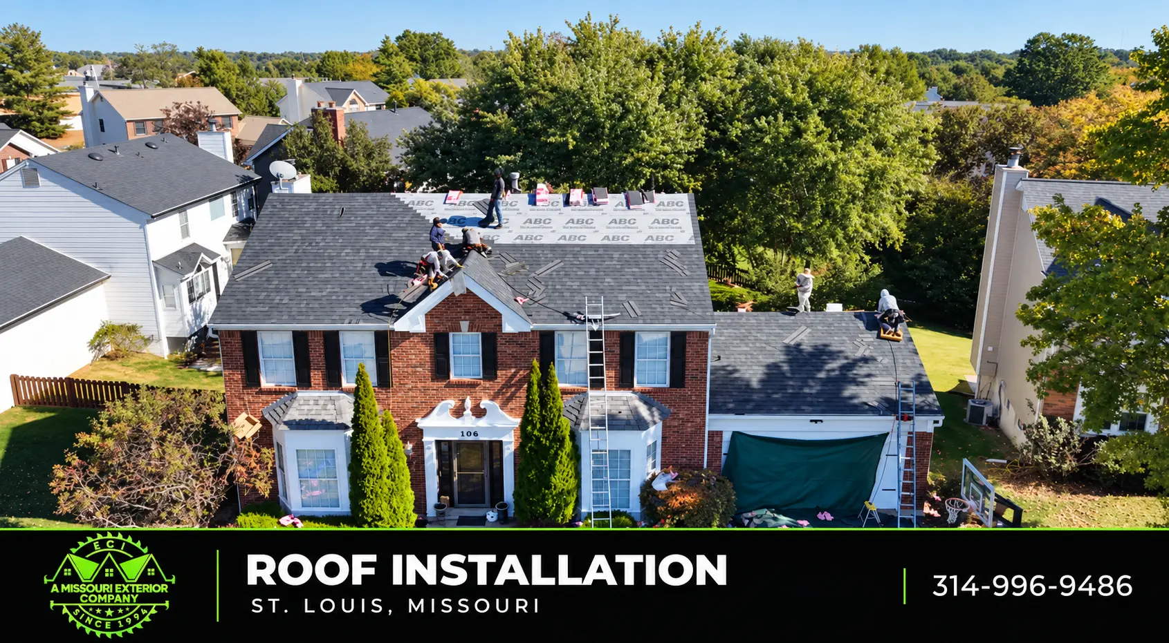 ECI crew installing a new roof on a brick two-story home in St. Louis
