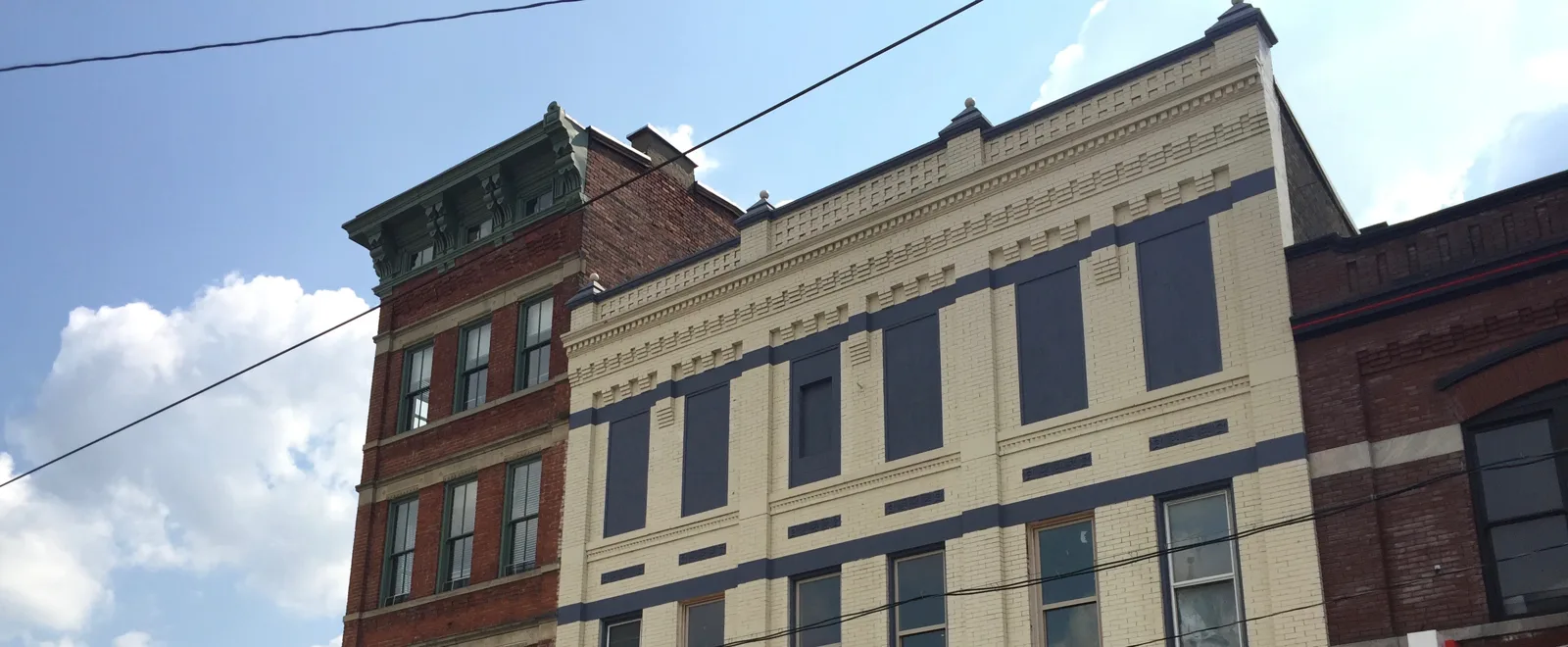 Illustrative stock photo of a brick parapet and cornice