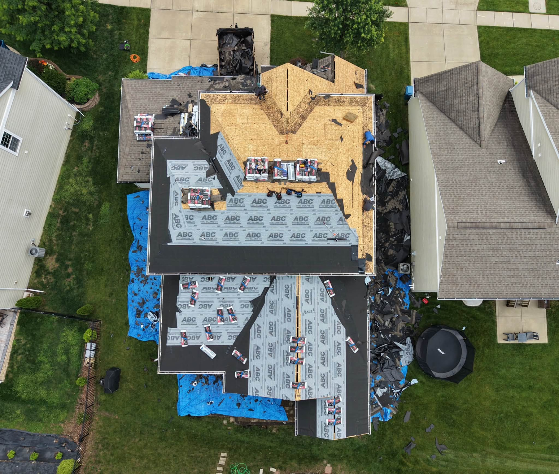 Aerial of a roof mid-restoration with underlayment down