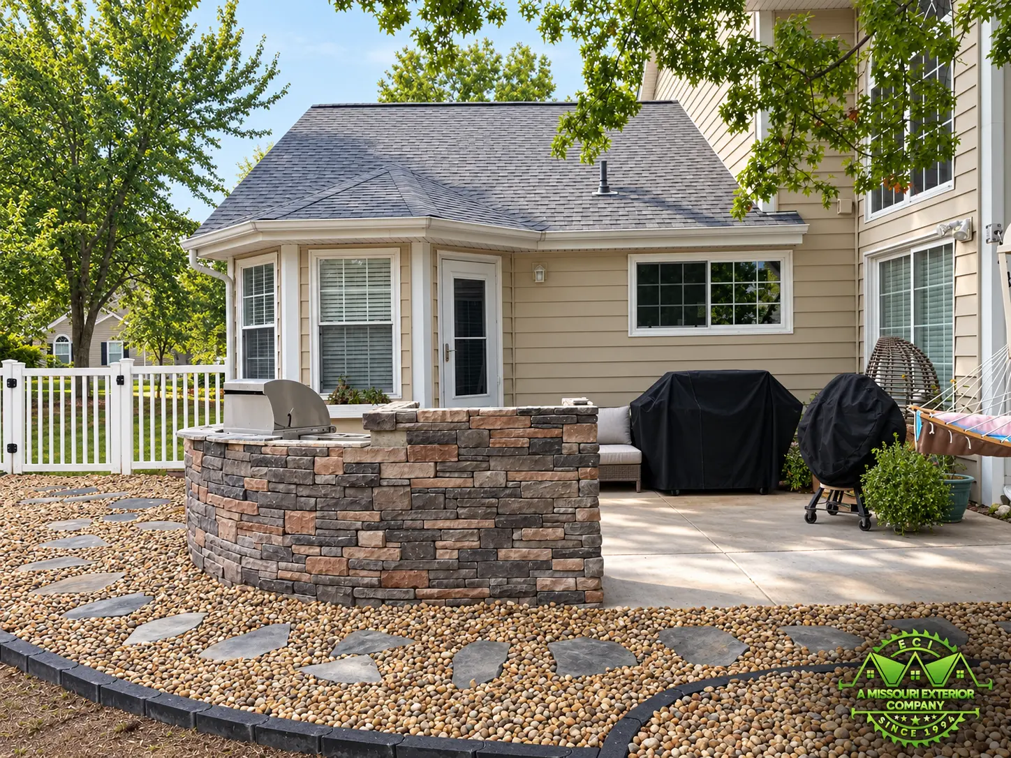 Curved stone kitchen surround and finished flagstone hardscape