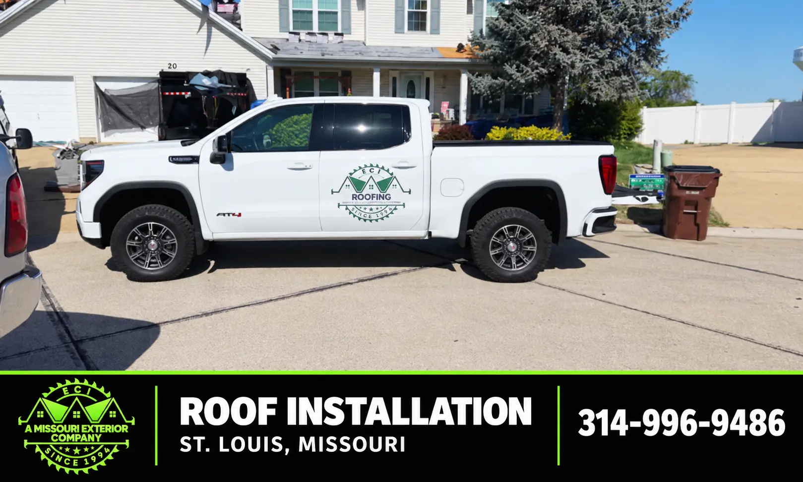 ECI truck at a St. Louis roof installation with crew on the roof