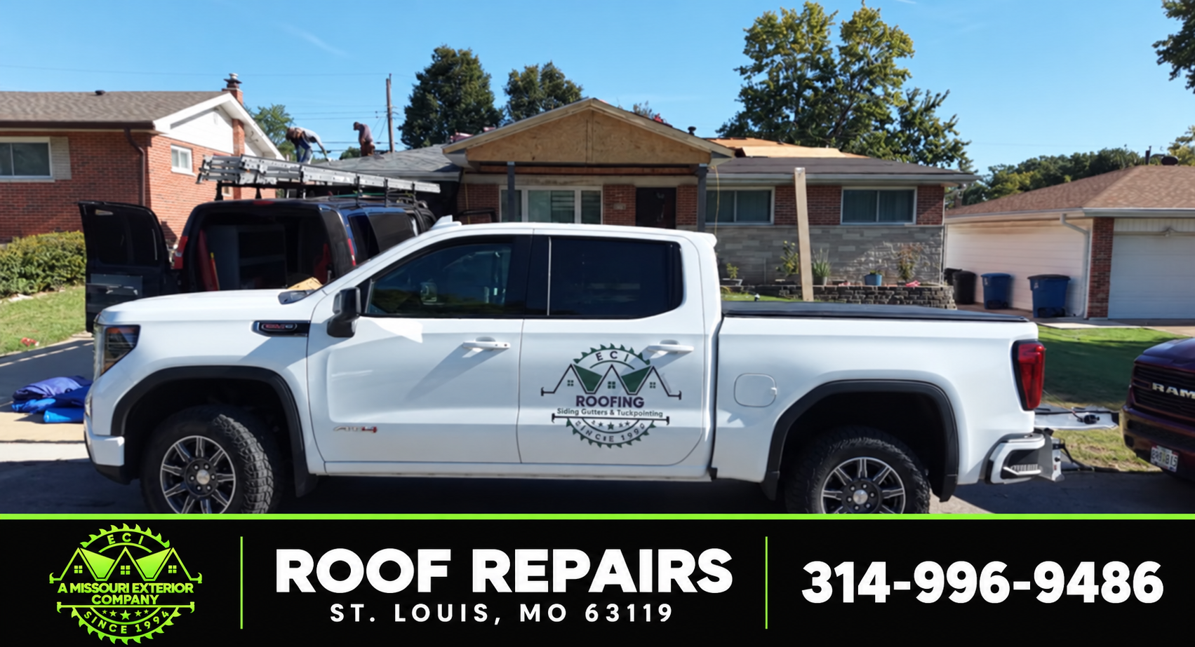 ECI truck at a St. Louis roof repair with crew on the roof