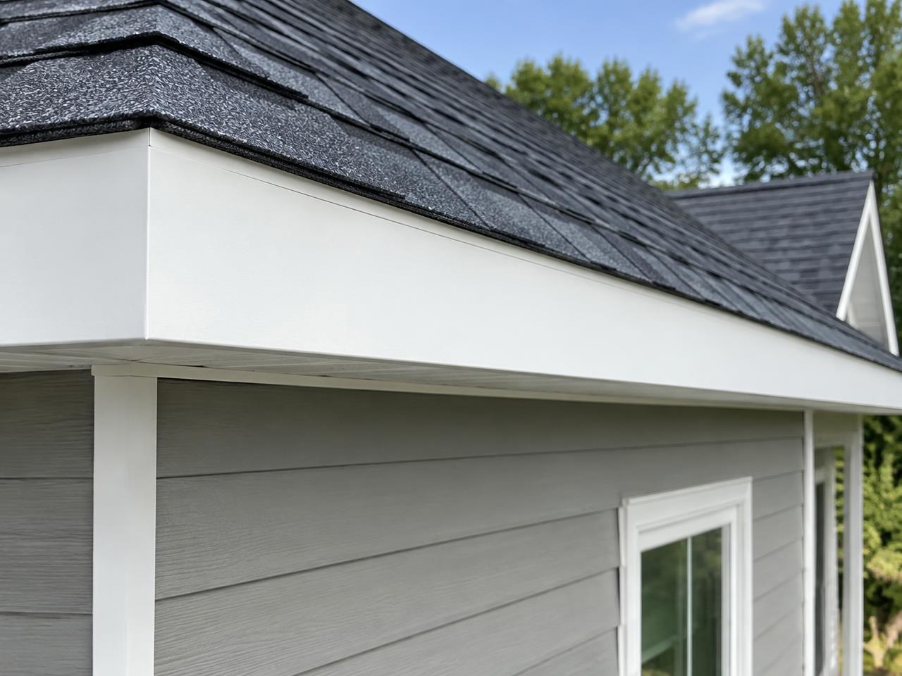 Fresh white fascia board along a home's roofline